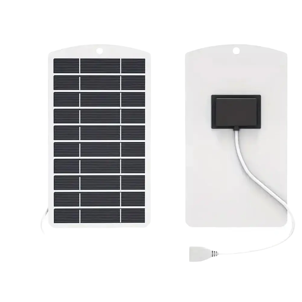 White rectangular solar panel charger with black photovoltaic cells and usb cable for portable outdoor power bank use