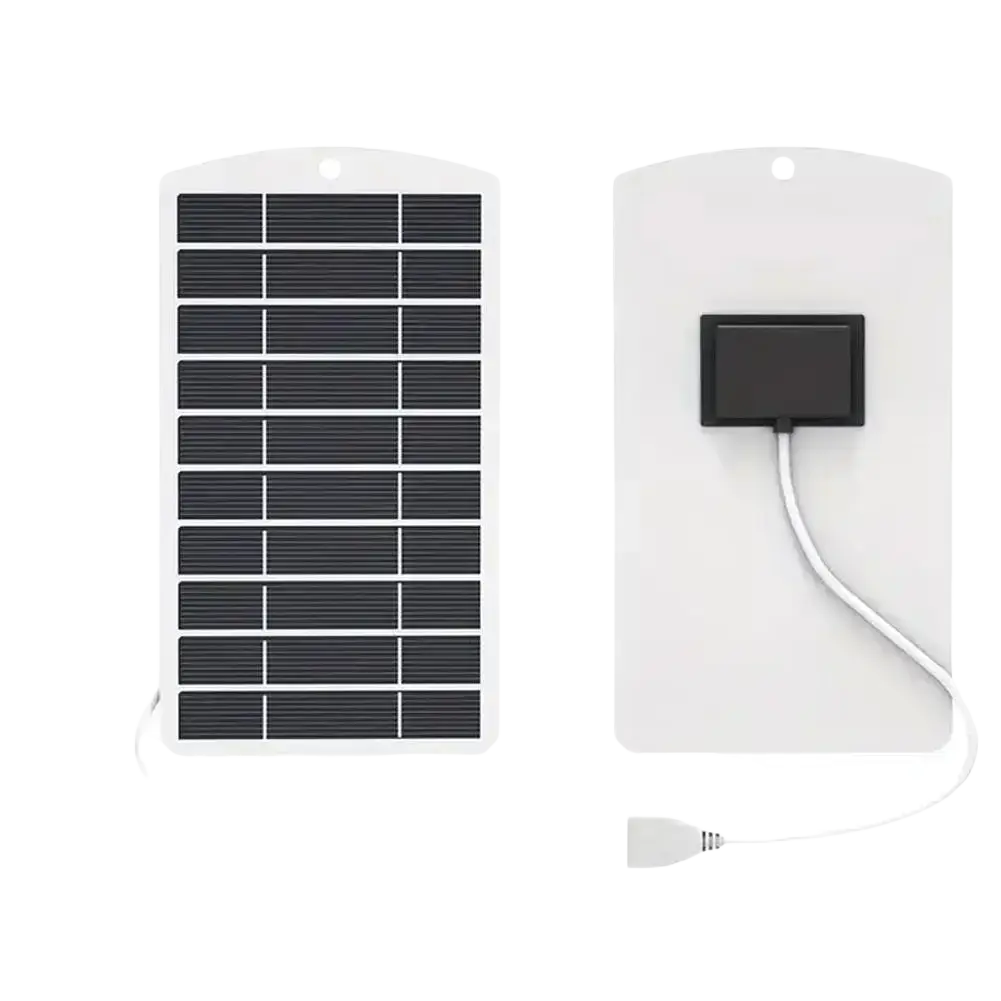 White rectangular solar panel charger with black photovoltaic cells and usb cable for portable outdoor power bank use