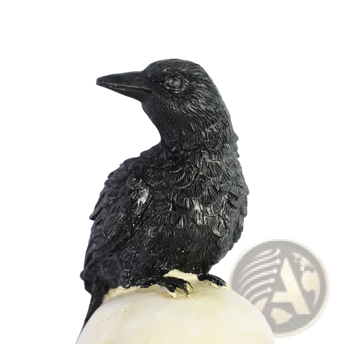 Black crow figurine with detailed feathers perched on cream-colored skull in solar skull and crow garden light