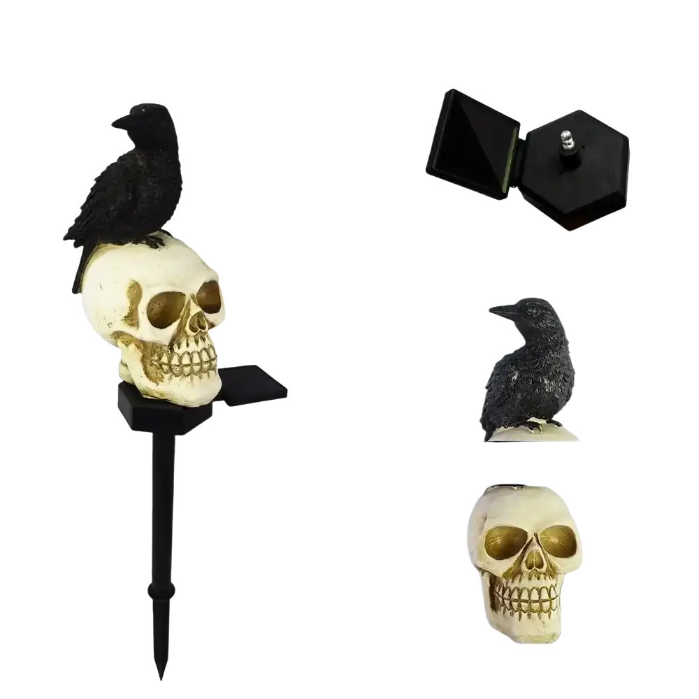 Black crow perched on cream-colored solar skull with gold eye sockets on a black garden stake halloween light
