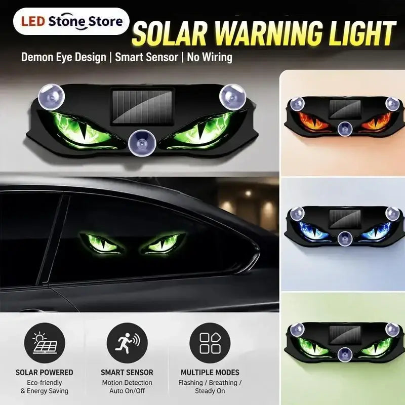 Black solar-powered warning light with devil-eye design and suction cups for easy car window mounting in green orange or blue