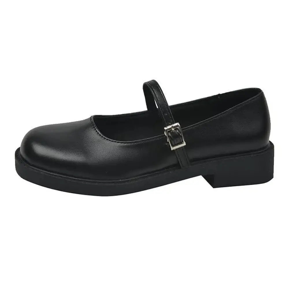 Black patent leather women’s mary jane flats with silver buckle chunky heel and square toe in french vintage style