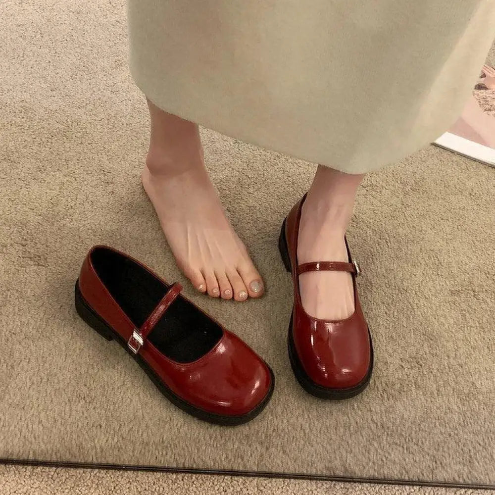 Women’s French vintage leather mary jane flats in shiny red patent with square toe silver buckle and thick black soles