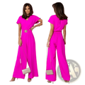 Vibrant fuchsia wide-leg jumpsuit with v-neckline, short sleeves, and ornate metallic belt buckle at the waist