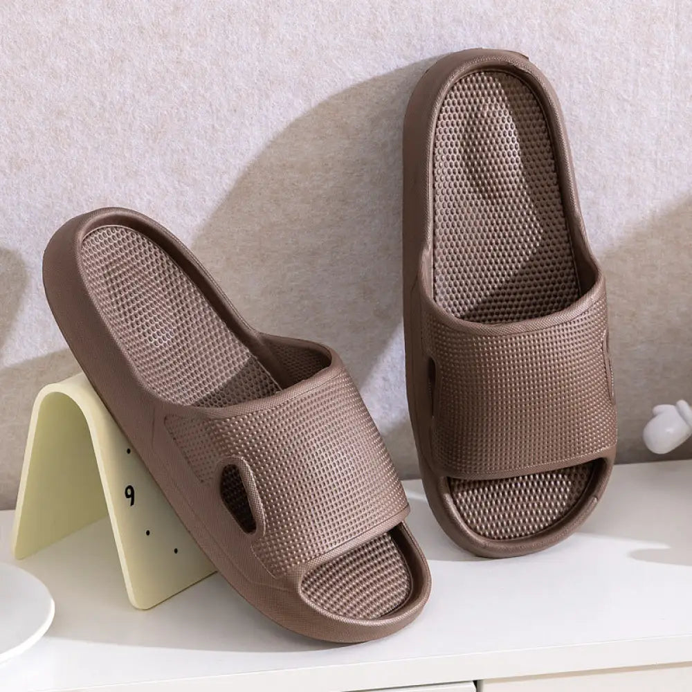 Brown mesh slide sandals with thick sole non slip cushioned design featuring textured breathable material for home use