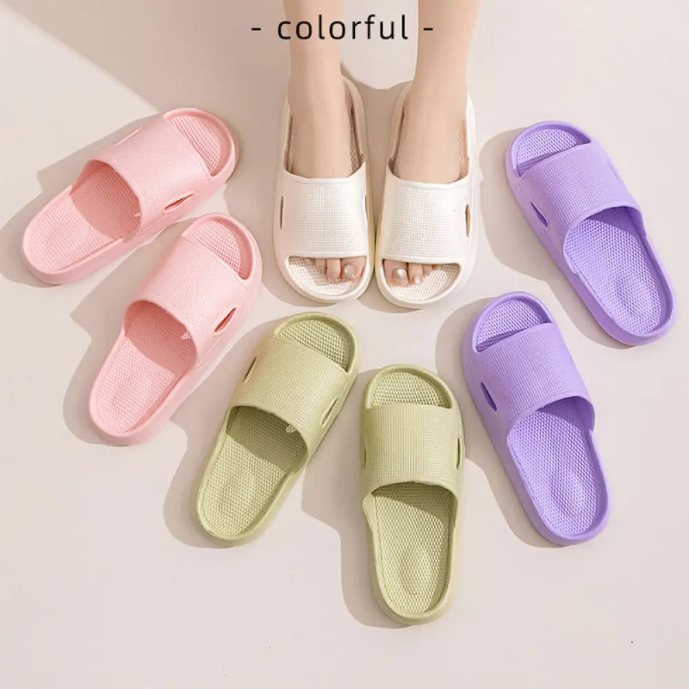 Pastel-colored plastic thick sole non slip cushioned home slide sandals in pink white green and purple with textured footbed