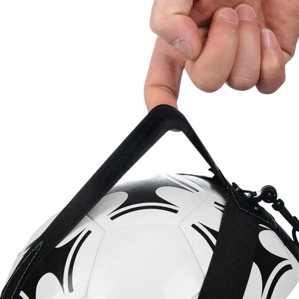 Solo soccer kick trainer belt with black fabric strap reinforced stitching and plastic buckle securing white soccer ball