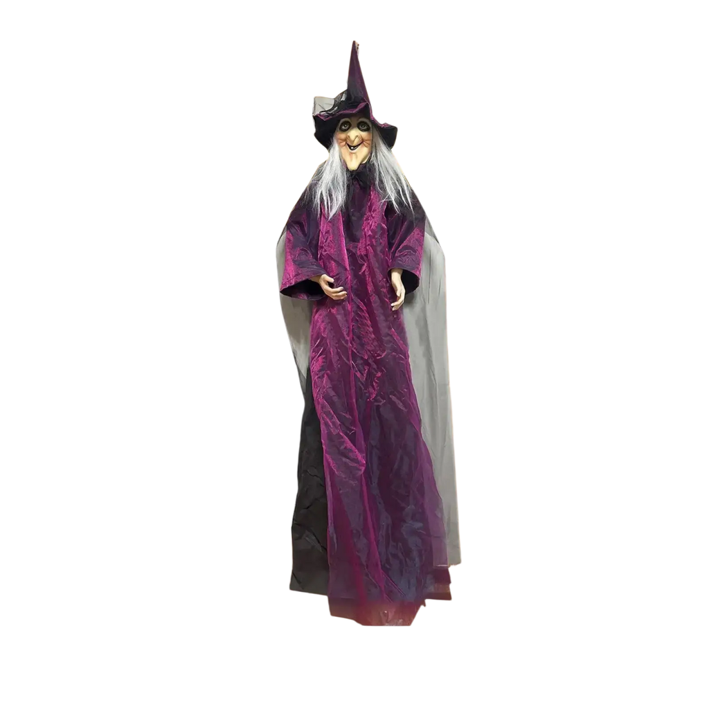 A sound activated halloween witch prop with a tall purple robe and pointed hat as a porch centerpiece