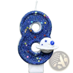 A blue glittery number eight birthday candle with colorful star sprinkles and a white spaceship charm for planetary party