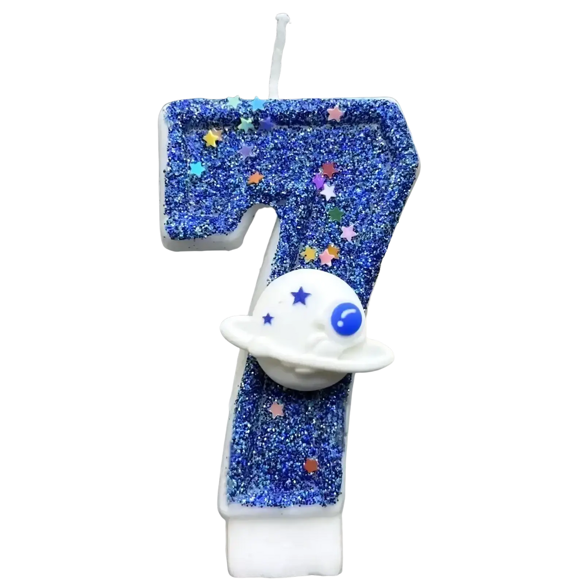 A blue glittery number seven birthday candle with colorful star confetti and a white planet topper for planetary party cake