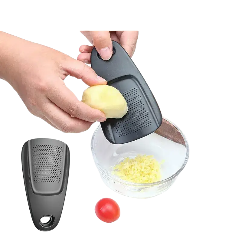 Black plastic garlic and ginger grinder with textured surface in space saving kitchen gadget set with bottle opener and pizza cutter