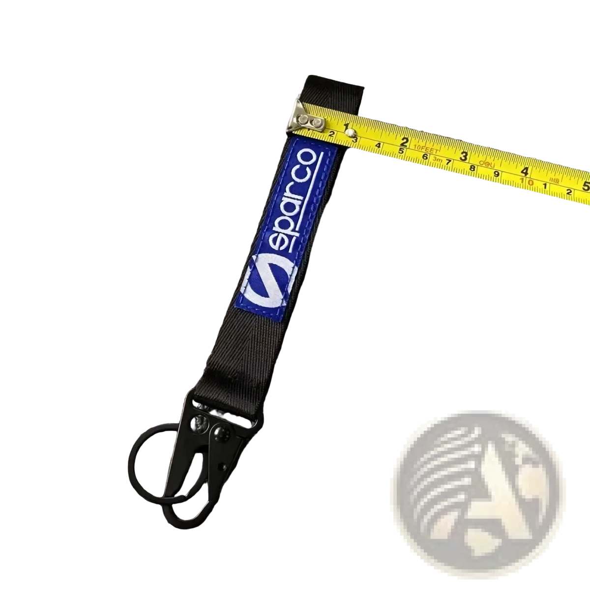 Black fabric sparco keychain with blue logo patch and metal carabiner clip for car accessory use