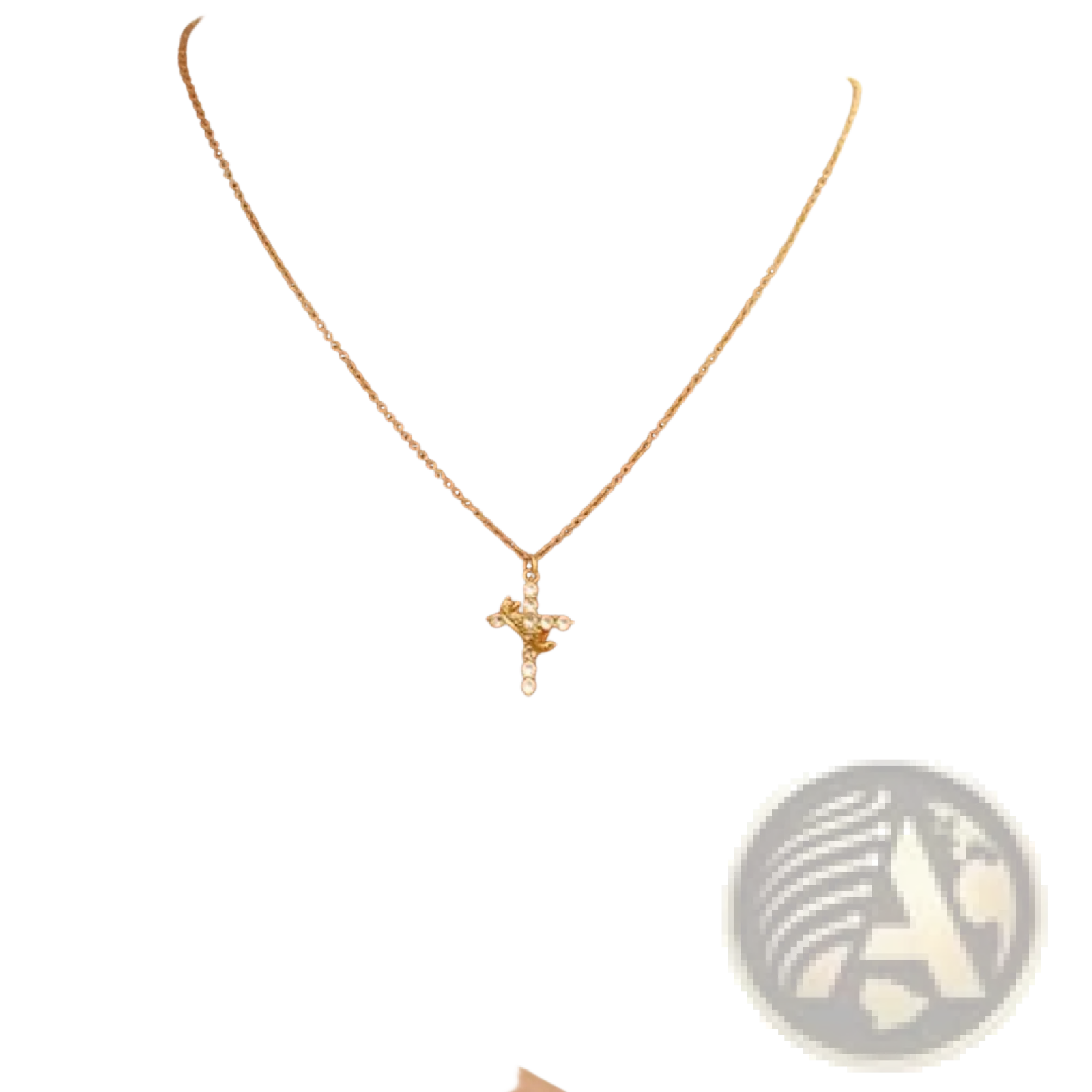 Gold cross necklace with delicate chain and sparkling gemstone details from the sparkling layered crown and cross pendant necklace collection
