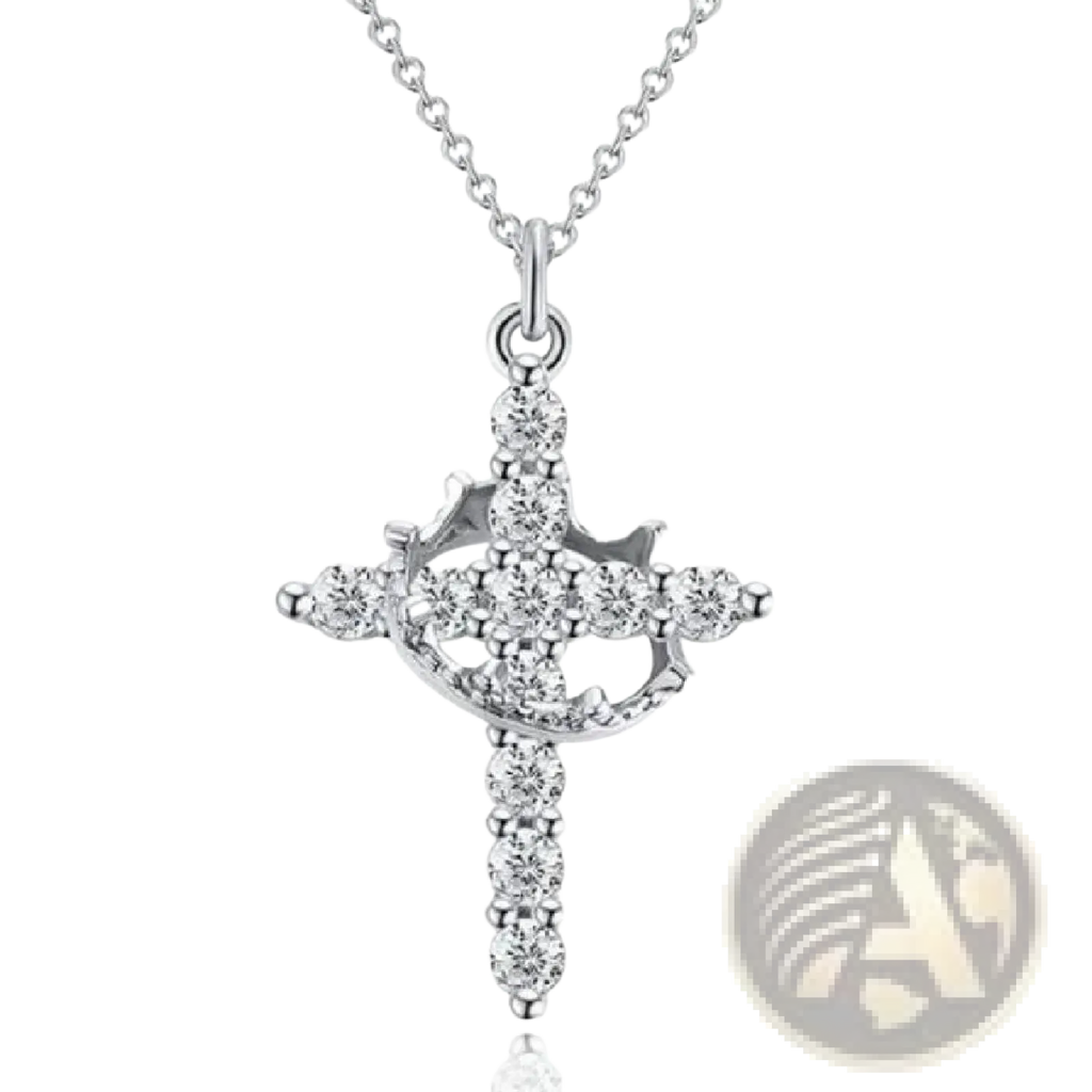 A sparkling layered crown and cross pendant necklace in silver adorned with numerous clear faceted gemstones