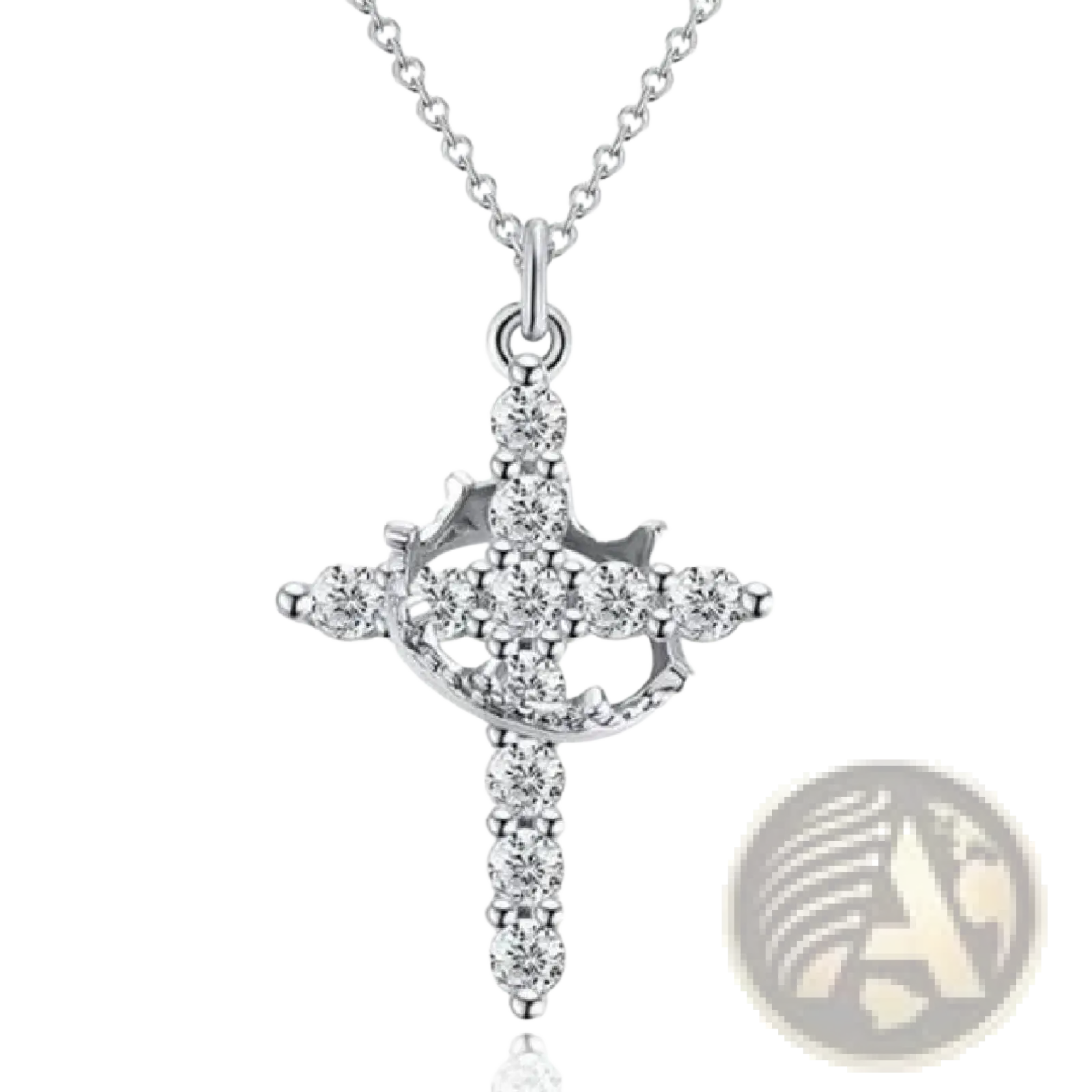A sparkling layered crown and cross pendant necklace in silver adorned with numerous clear faceted gemstones