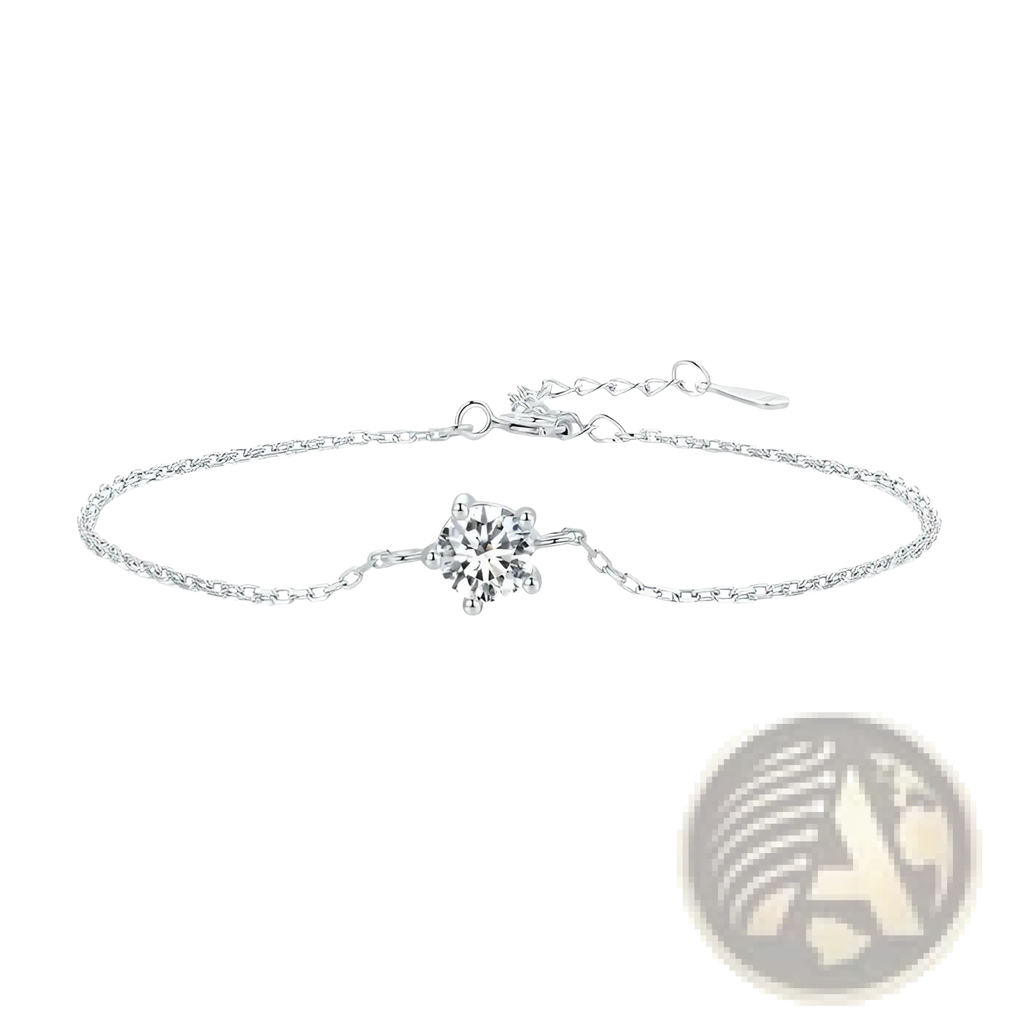 A delicate silver chain bracelet with a single sparkling round-cut moissanite diamond in a four-pronged clasp
