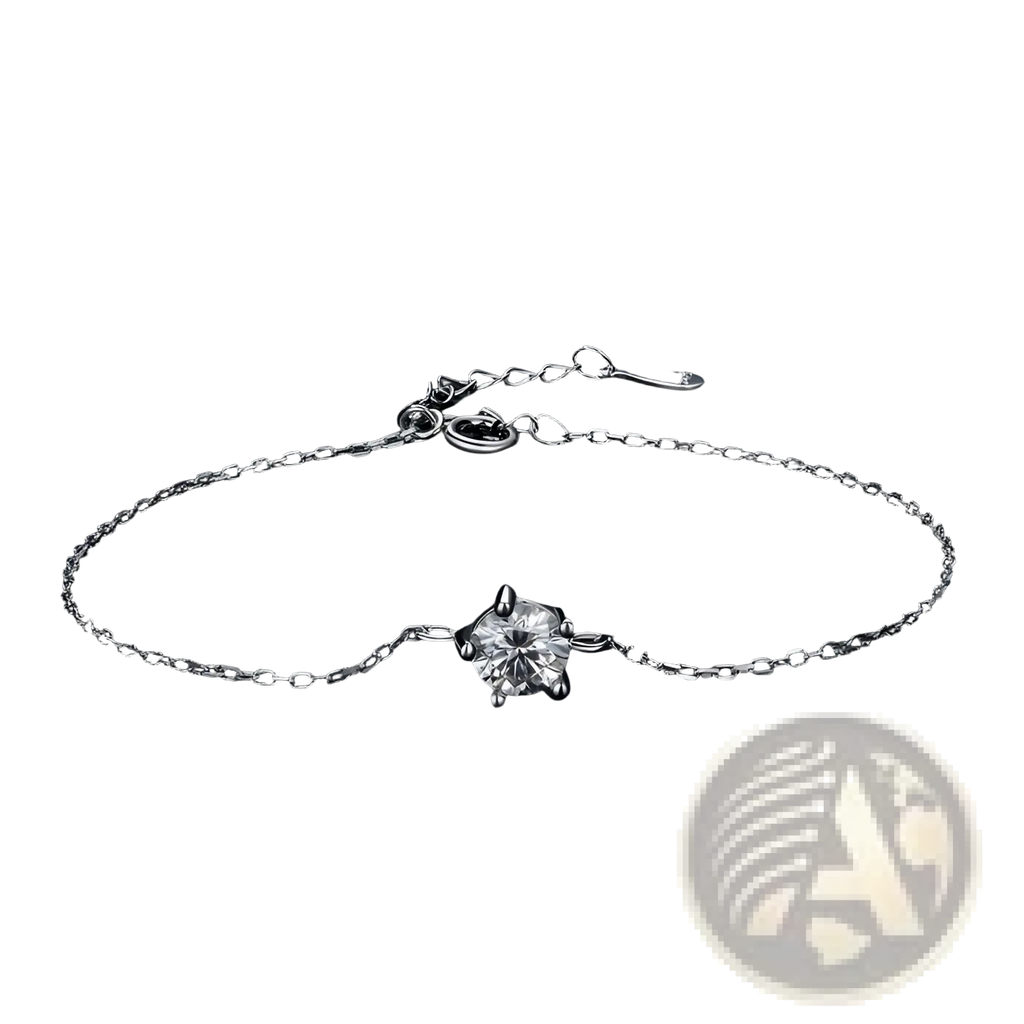 A delicate silver chain bracelet with a single sparkling round-cut moissanite gemstone centered on the band