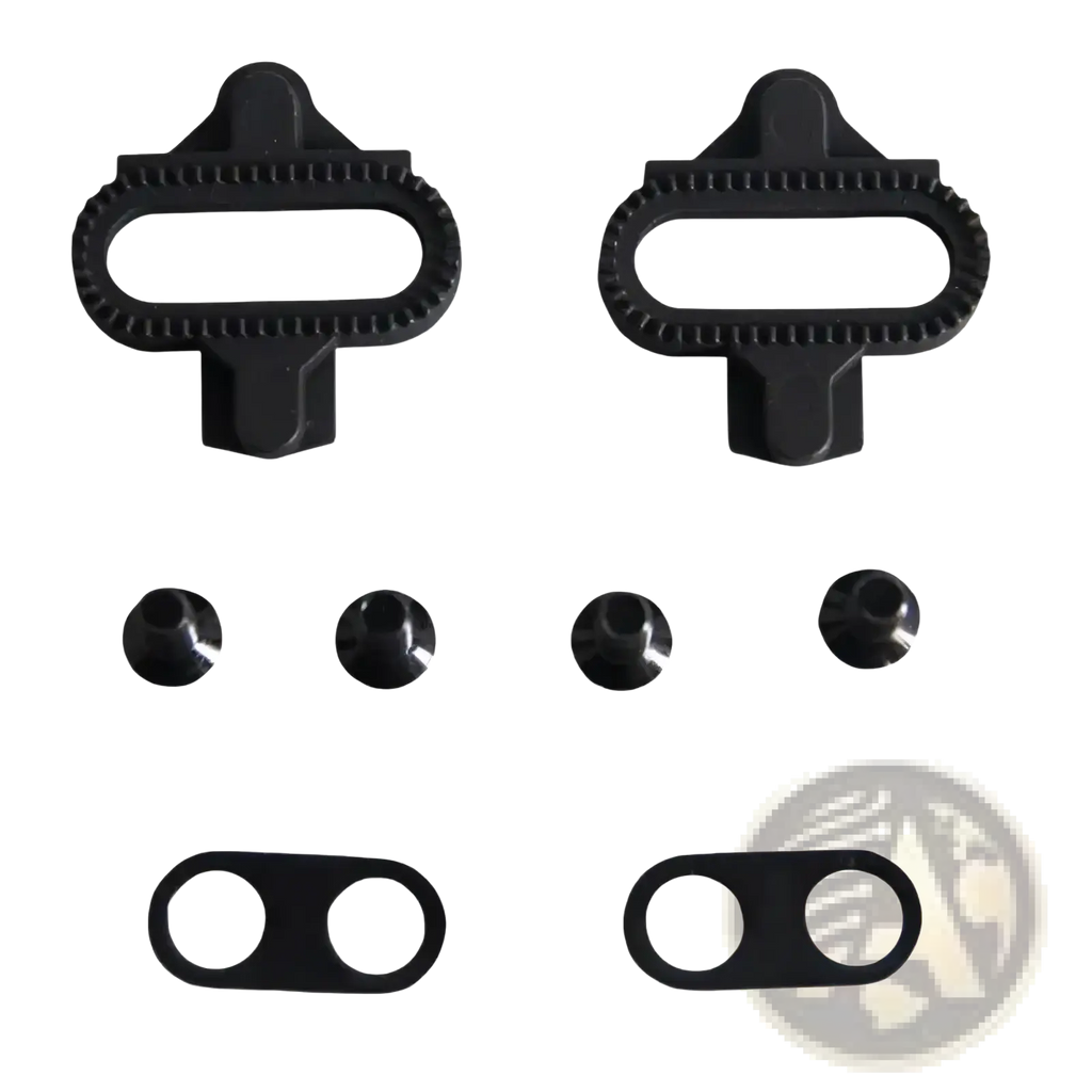 Black plastic spd pedal cleats kit with textured edges, black screws, and spacers for mountain bikes