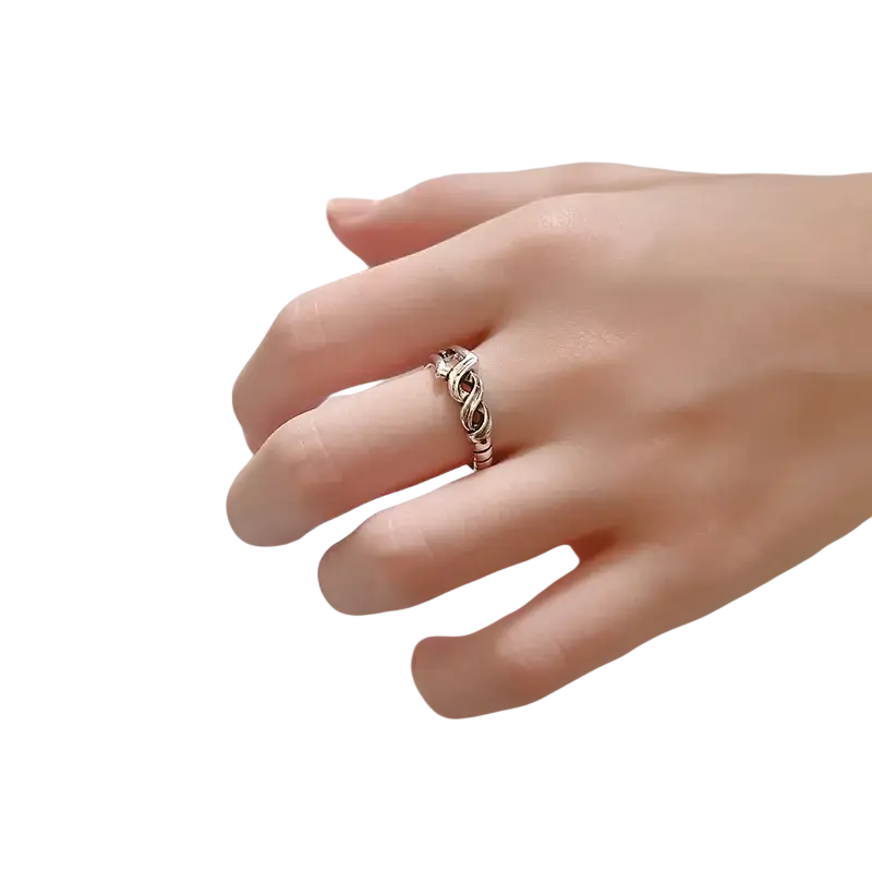 A delicate silver Spear of Longinus adjustable ring with an intricate twisted knot design suitable for bank transfers