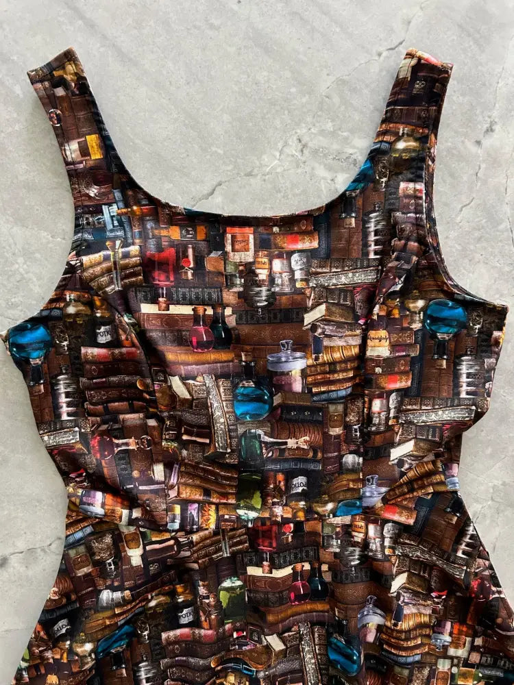 Spellbinding cityscape print skater dress with pockets featuring a sleeveless vintage lab glassware and book print in earthy tones and blue accents