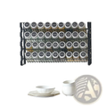 Black metal spice rack organizer with four tiers holding 36 clear glass jars with silver lids and black labels
