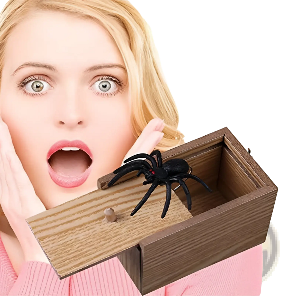Black plastic spider with red eyes emerging from wooden surprise box in spider prank scare box wooden trick toy