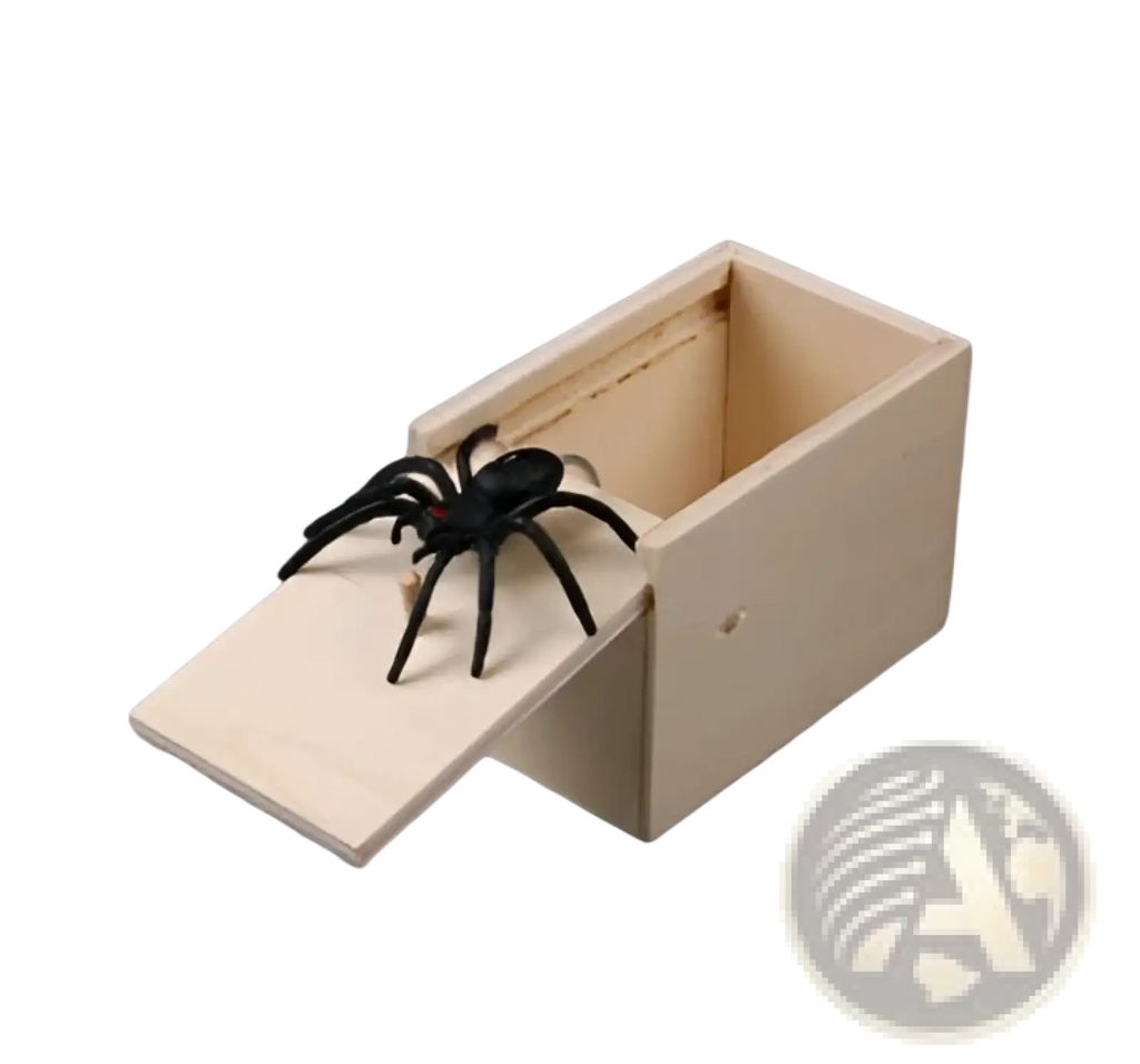 Black plastic spider toy inside a light wooden sliding box for spider prank scare box wooden trick surprise toy
