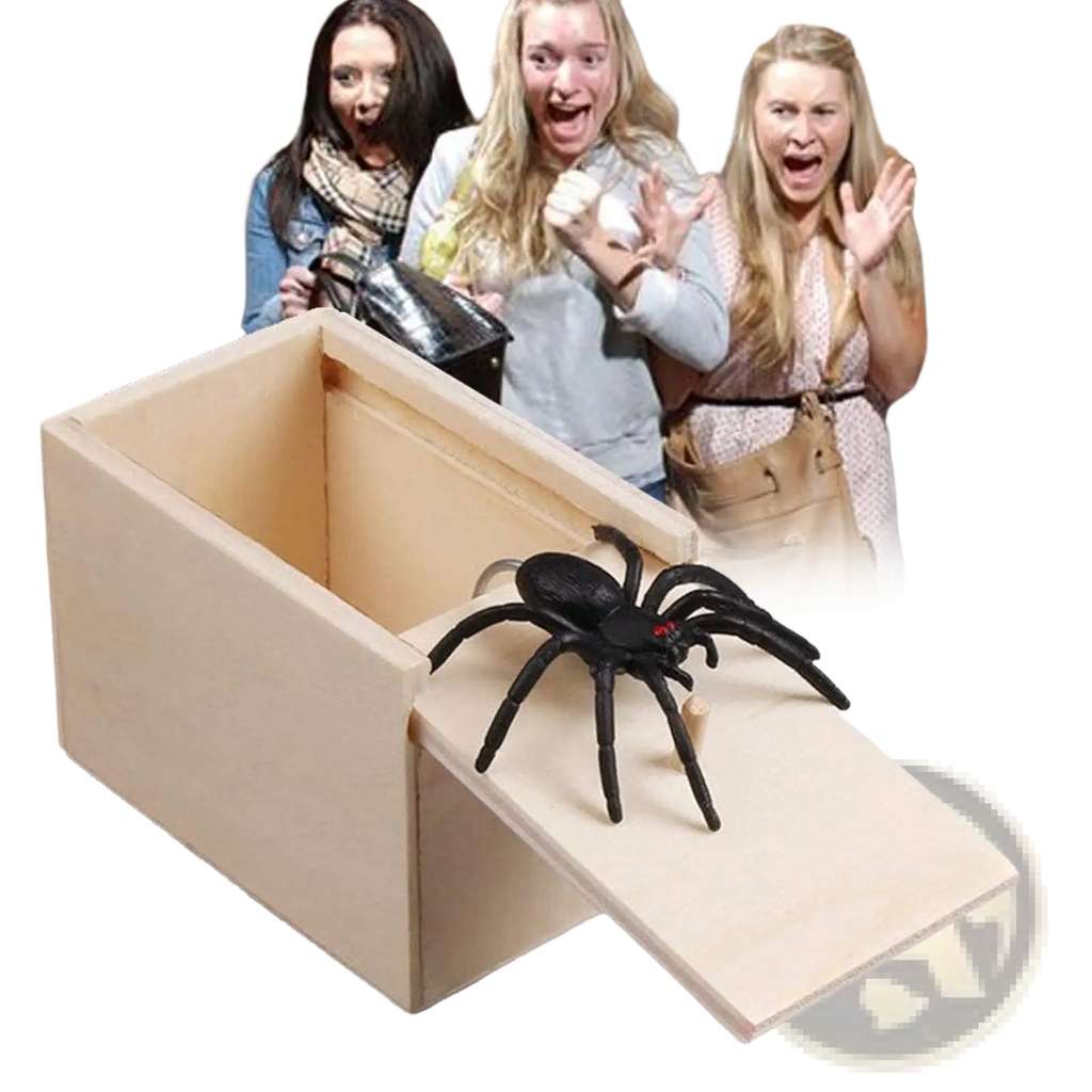 Black plastic spider with red eyes on a light wooden box in spider prank scare box wooden trick surprise toy