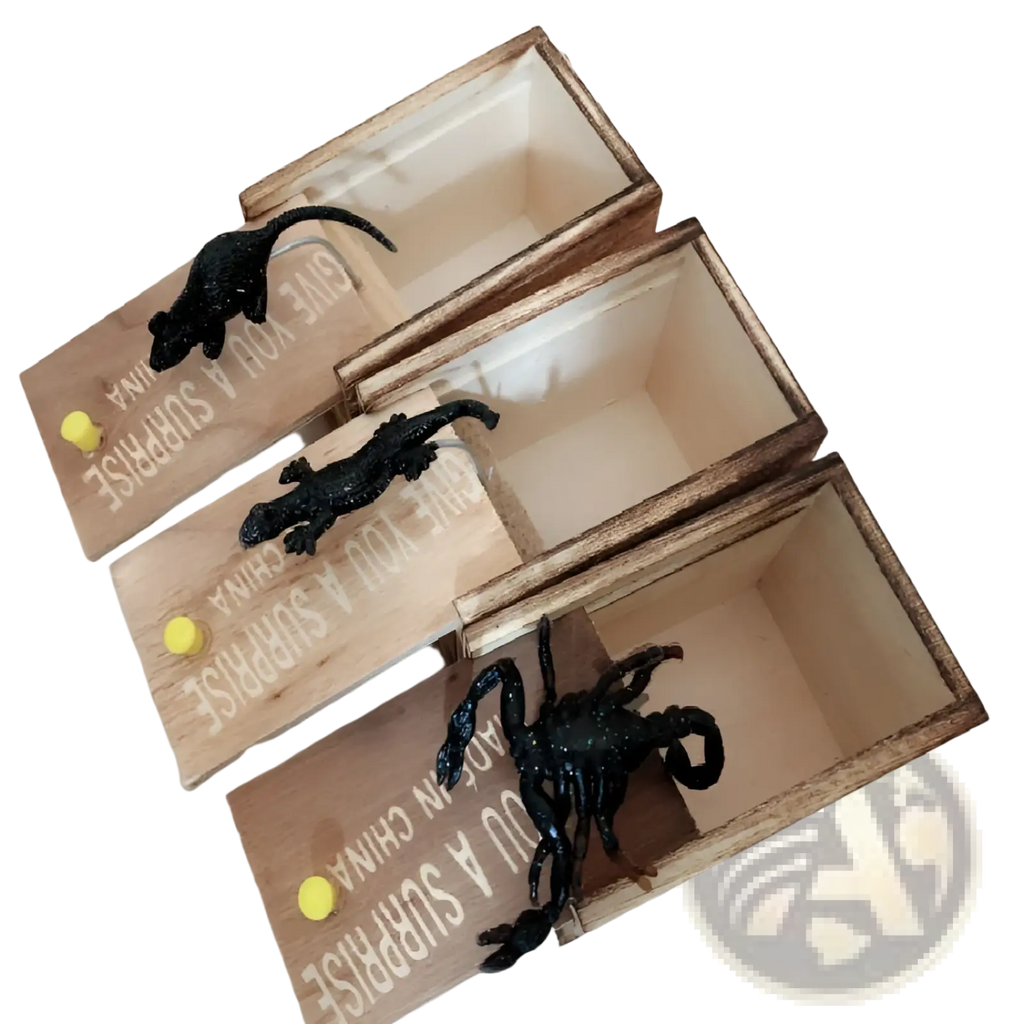 Three wooden spider prank scare boxes with clear panels and black plastic mouse alligator and scorpion figurines