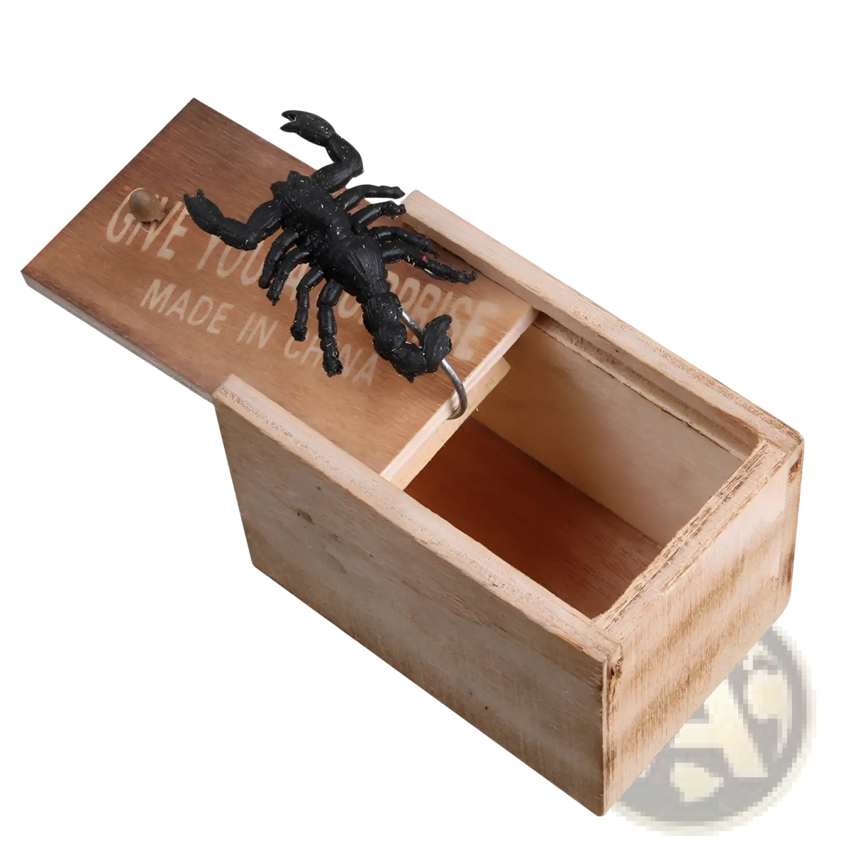 A black plastic scorpion figurine on a light brown wooden spider prank scare box with engraved surprise text