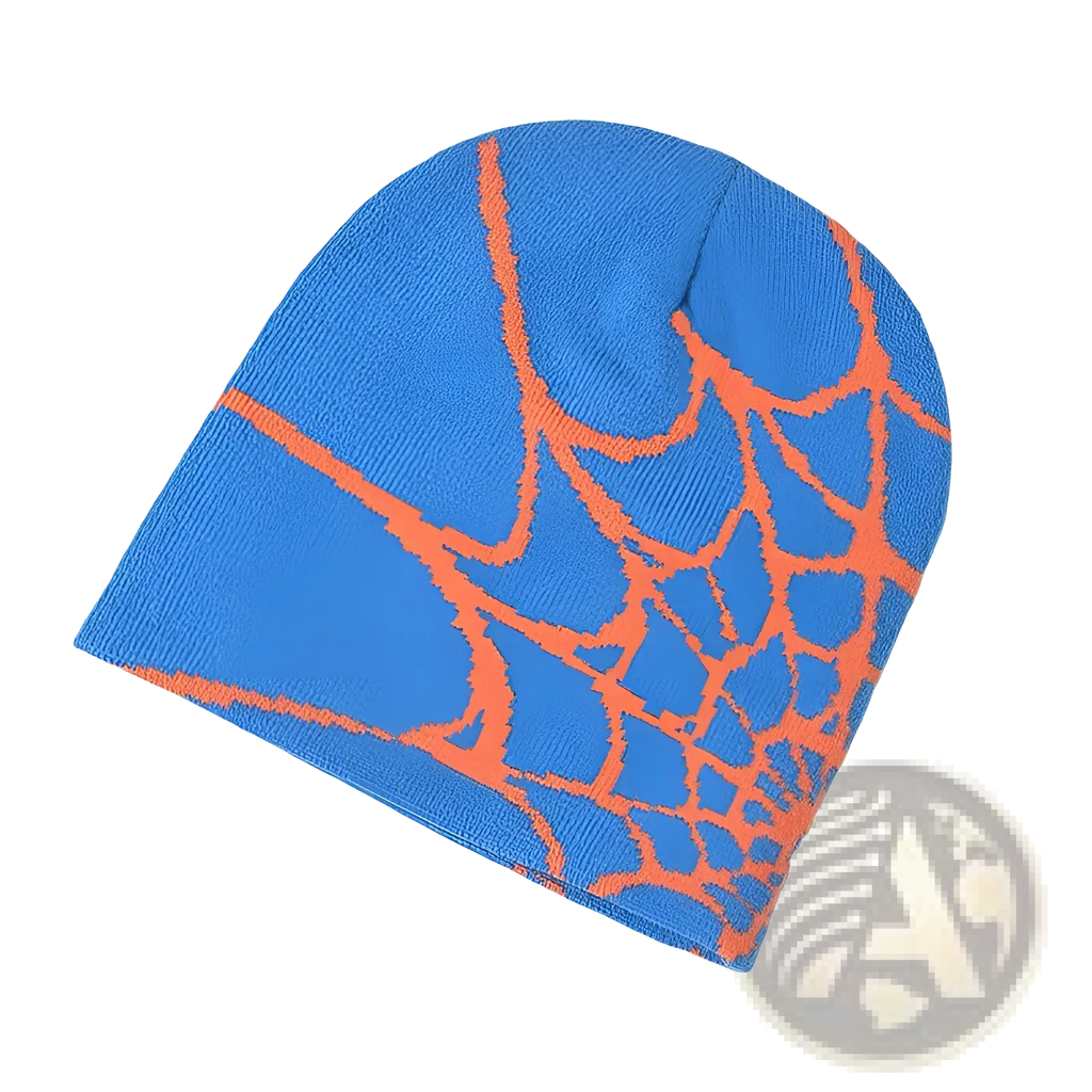 Blue knit spiderweb beanie winter hat featuring an orange spiderweb pattern ideal for cold weather wear