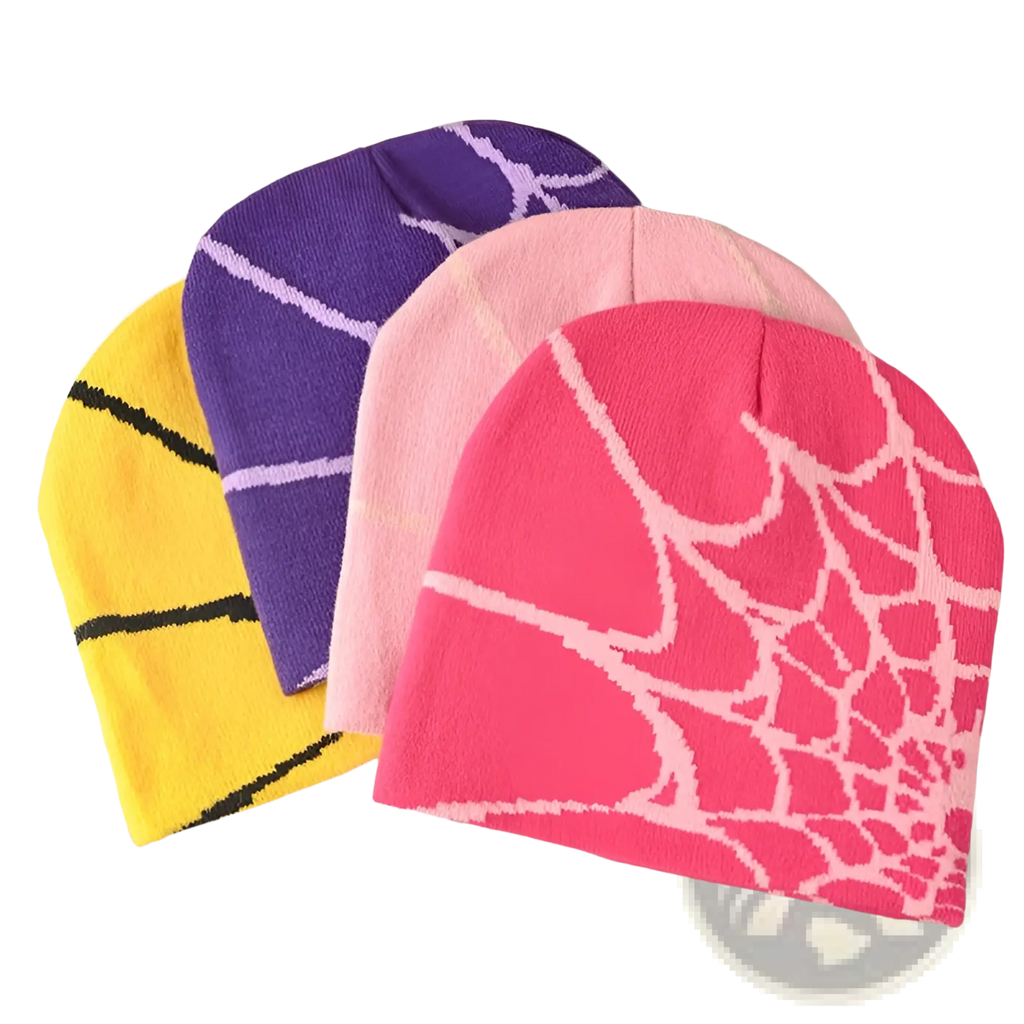 A vibrant pink knit spiderweb beanie featuring a bold white pattern designed for winter wear