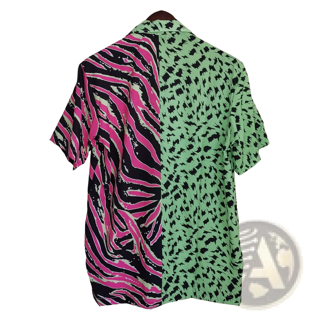 A vibrant split animal print pink and green short sleeve shirt with zebra and leopard patterns