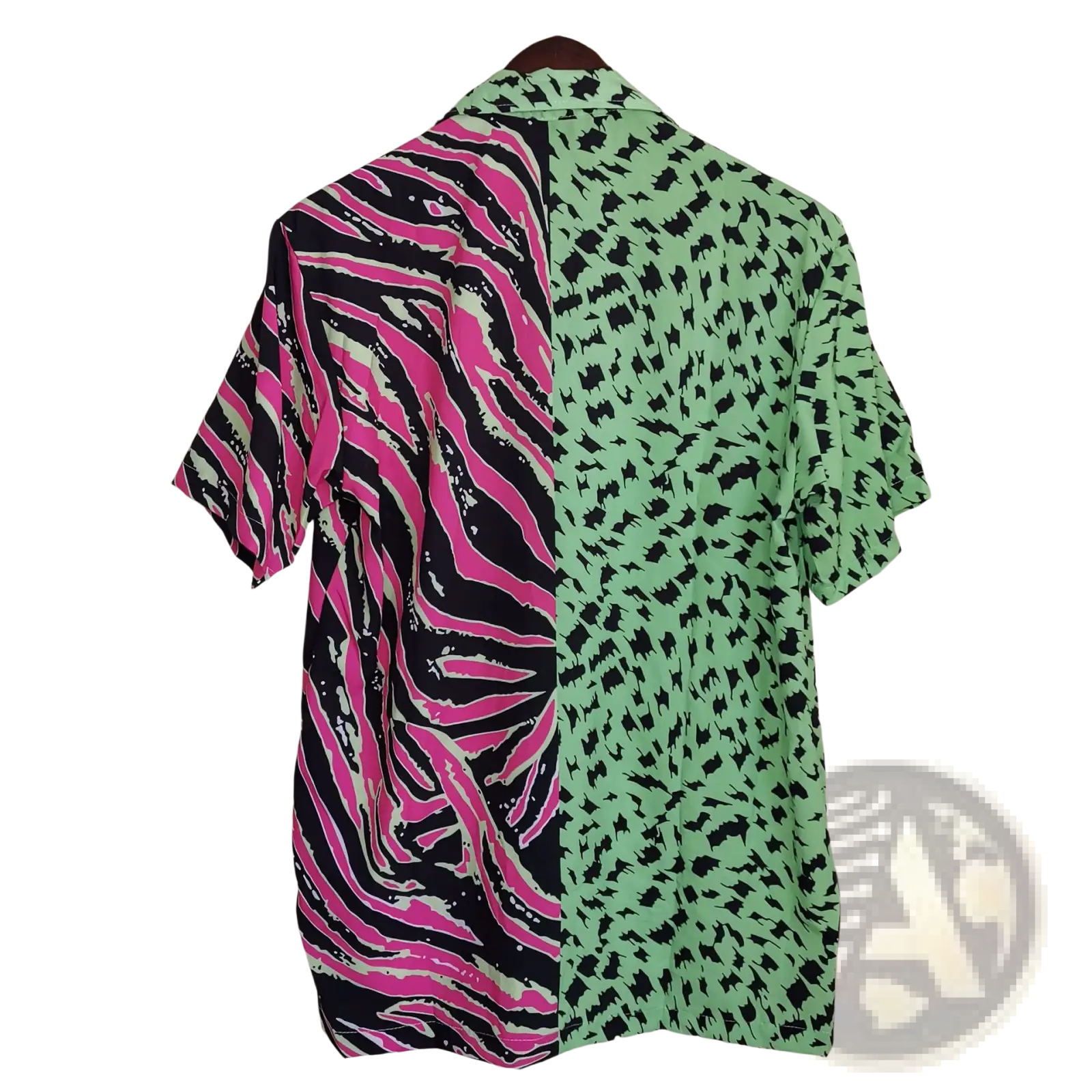 A vibrant split animal print pink and green short sleeve shirt with zebra and leopard patterns