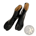 Black patent leather split toe tabi high heel ankle boots with tan lining showing the front view