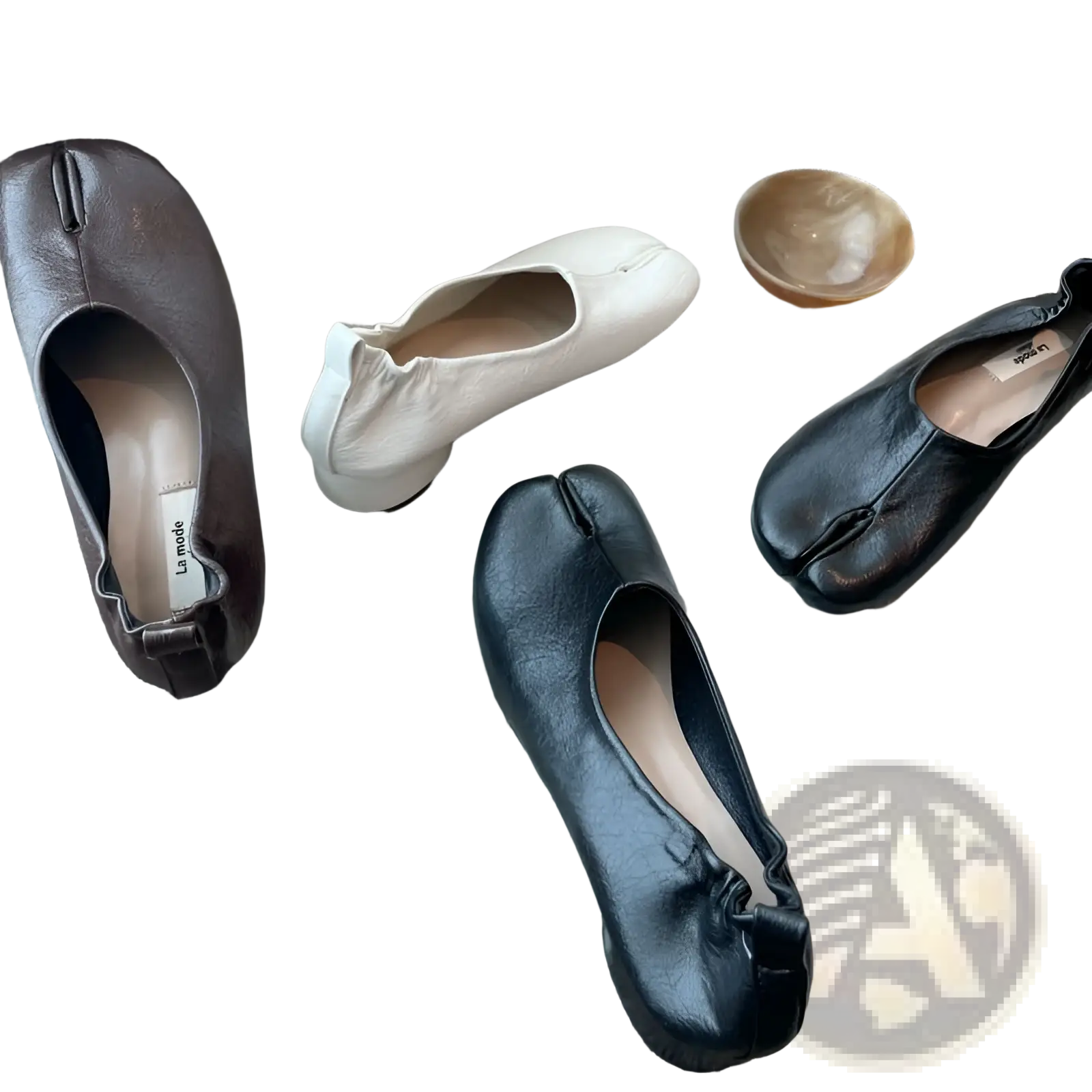Black leather split toe tabi pumps with glossy finish and mid heel showcasing distinctive toe separation