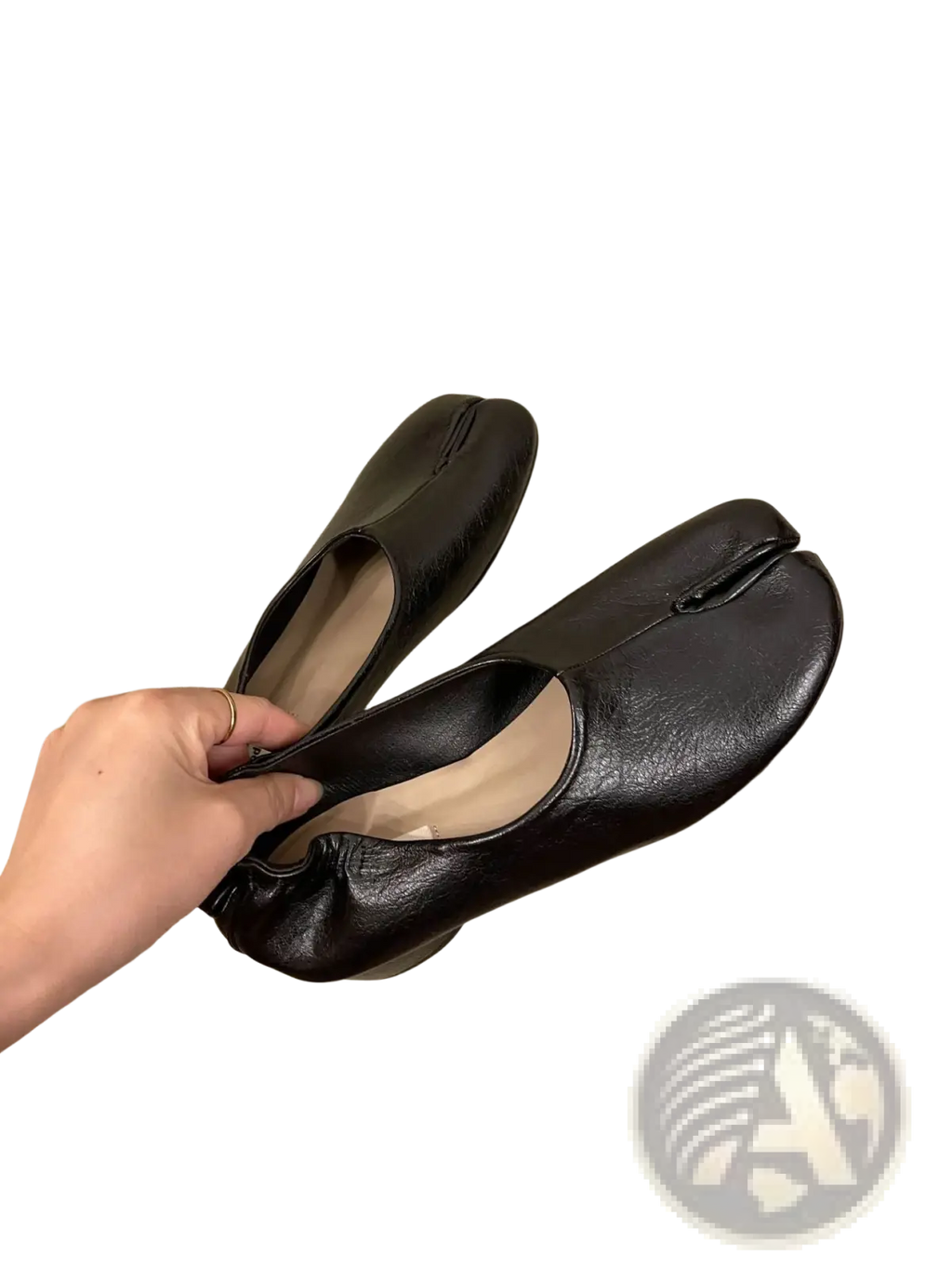 Black leather split toe tabi mid heel moccasin-style pumps with distinctive toe seam design and horseshoe shape