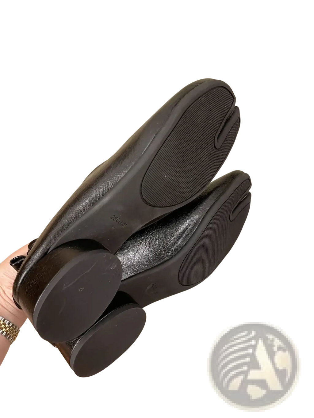 Black leather split toe tabi pumps with sleek minimalist design and rounded toe mid heel horseshoe shoes