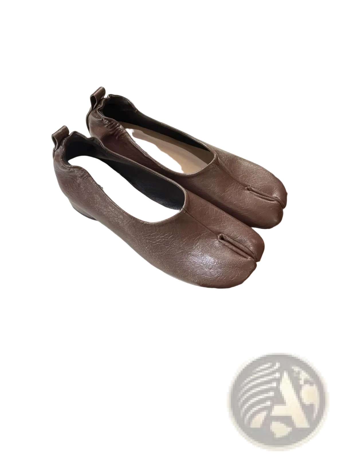 Brown leather split toe tabi pumps with mid heel and distinctive toe separation design shown from the back side