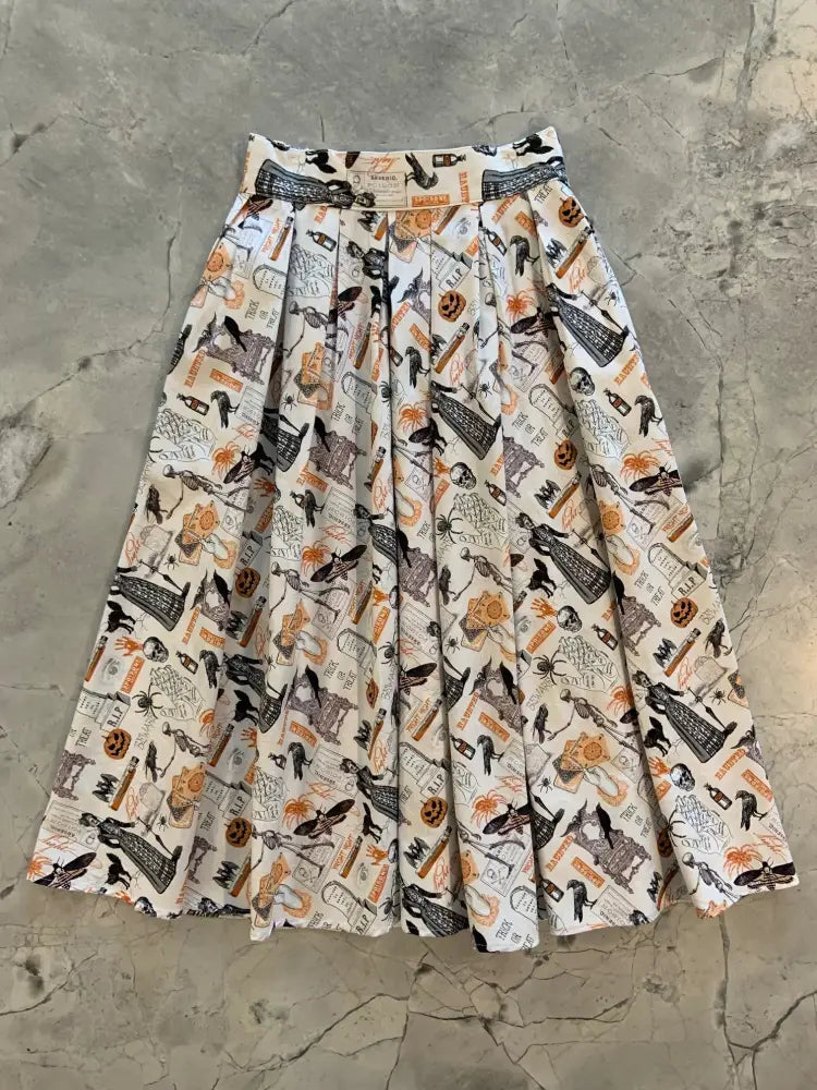 Spooky Doris vintage pleated Halloween skirt in cream cotton with black and orange spooky prints and pockets
