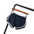 Navy blue sports shorts women with white trim and elastic waist suitable for casual athletic use
