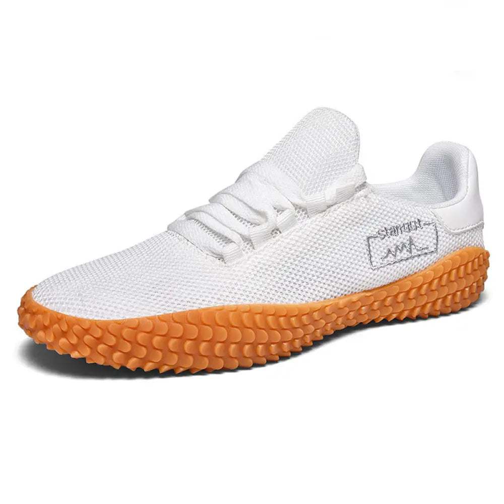 Men’s breathable flying woven mesh Korean sneaker in white with textured orange rubber sole and subtle side logo