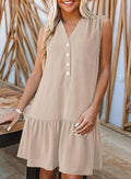 Beige sleeveless summer dress with v-neck button front detail and tiered hem ideal for warm weather wear