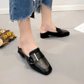 Black leather mules with square toe and silver buckle from the square toe buckle leather loafers and mules collection