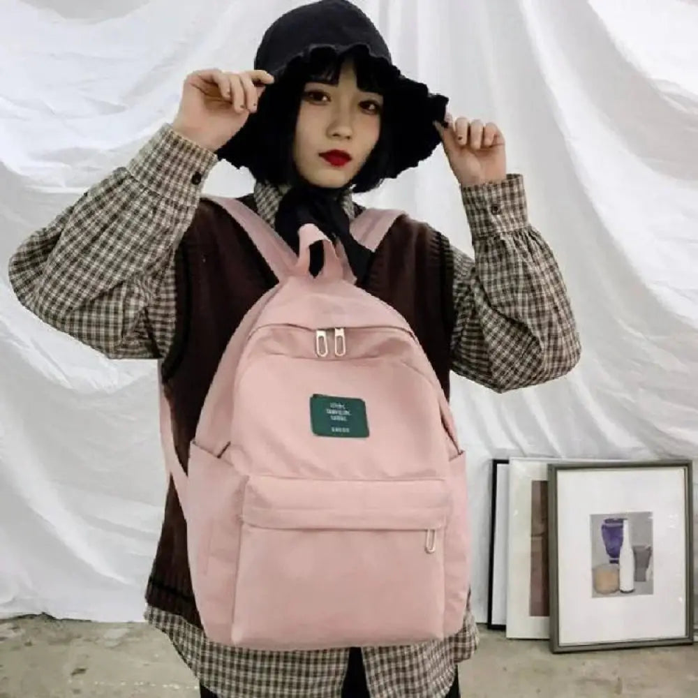 Women’s korean corduroy pastel pink canvas backpack with green patch and silver zipper pulls for school and travel