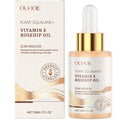 Ouhooe squalane wrinkle reducing skincare oil with vitamin e and rosehip oil in clear glass bottle with gold dropper and cream packaging