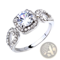 A silver square cut diamond halo engagement ring with a large clear gemstone and ornate band design