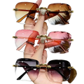A hand holds three pairs of square gradient sunglasses for women in brown lenses and gold metal frames