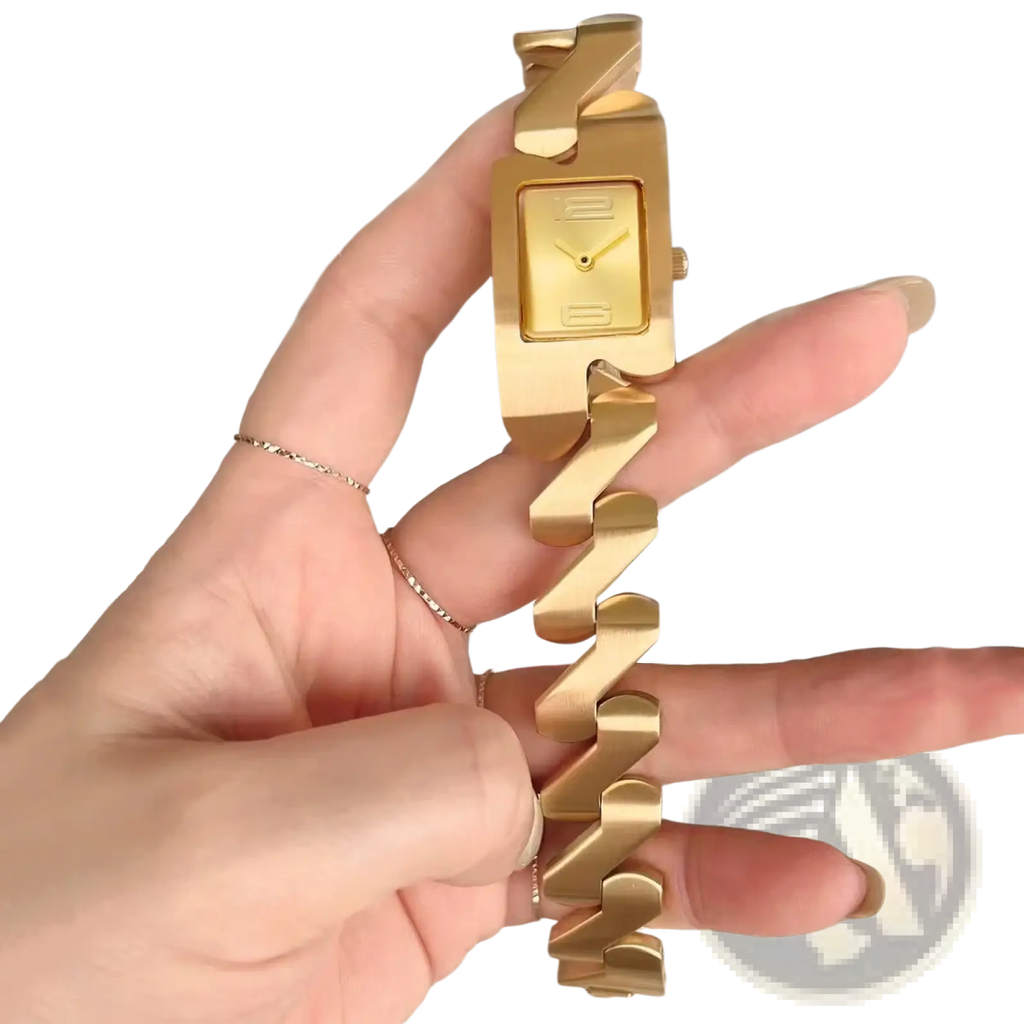 Square quartz watch in gold stainless steel with a bold geometric chain bracelet and minimalist rectangular face