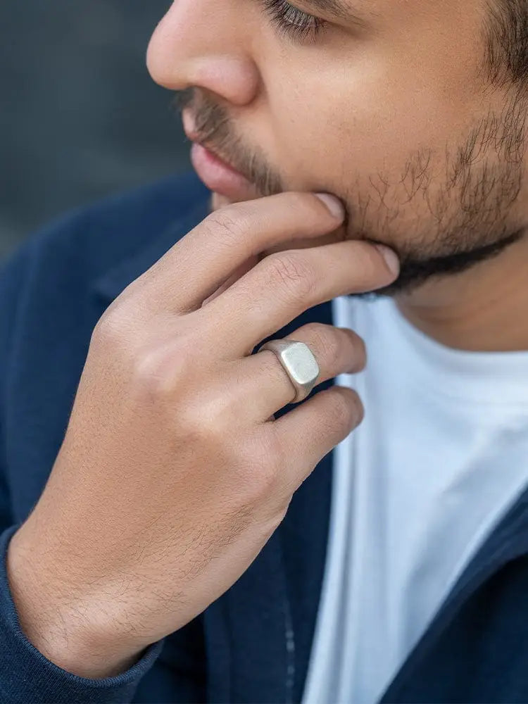 Oxidized silver square signet ring in stainless steel with smooth rectangular face and polished edges